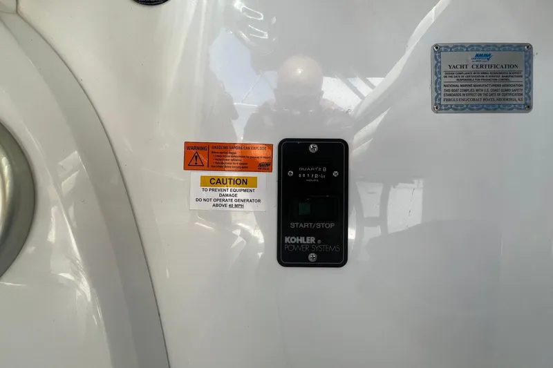 Slide: The Image of Control panel on a 2008 Cobalt 323 yacht with caution and certification labels. - 22