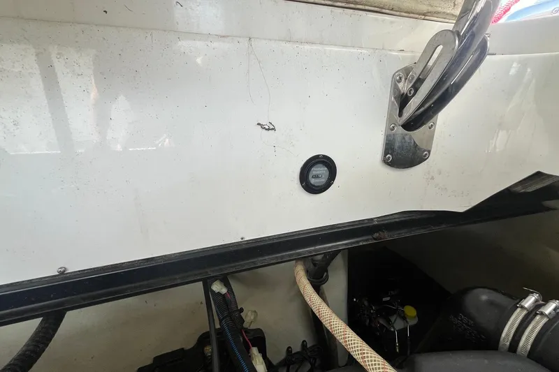 Slide: The Image of 2008 Cobalt 323 boat interior showing wiring and mechanical components. - 25