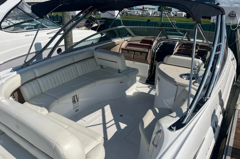 Slide: The Image of 2008 Cobalt 323 boat interior with white seating and sleek dashboard design. - 7