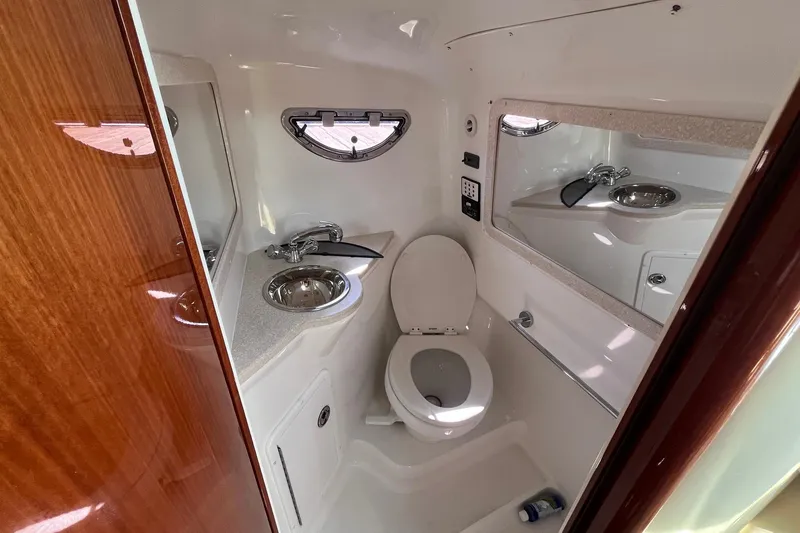 Slide: The Image of Compact bathroom in 2008 Cobalt 323 boat with sink, toilet, and mirror. - 32