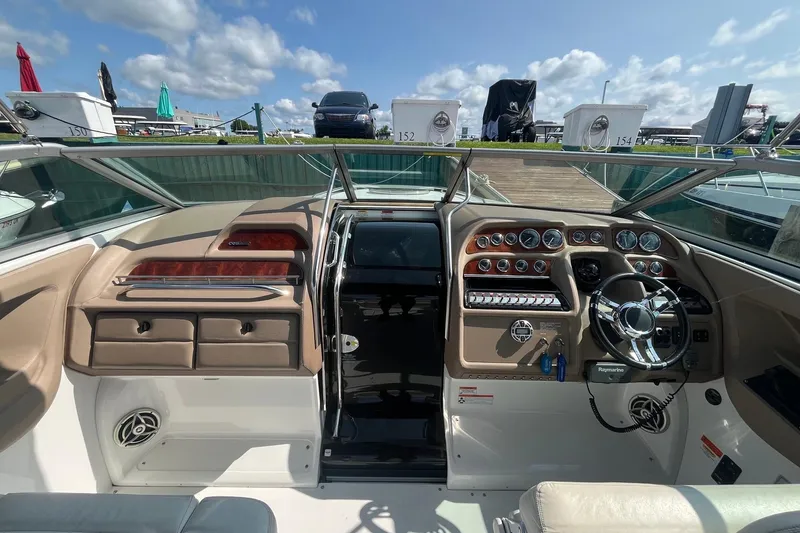 Slide: The Image of Interior view of a 2008 Cobalt 323 boat cockpit with steering wheel and dashboard controls. - 18