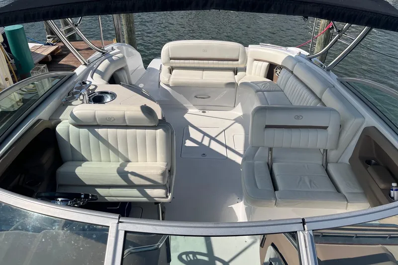 Slide: The Image of Luxurious 2008 Cobalt 323 boat interior with plush seating and sleek design on the water. - 6