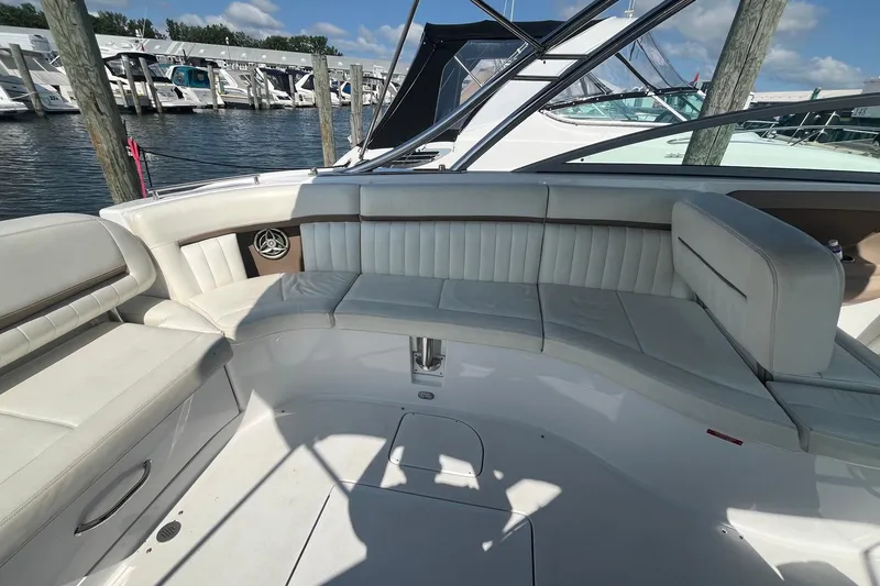 Slide: The Image of Luxurious seating area on a 2008 Cobalt 323 boat docked at a marina. - 13