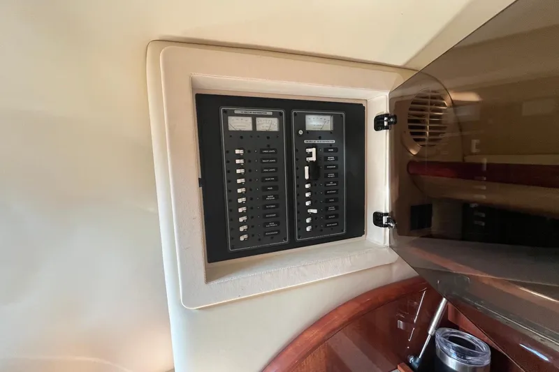 Slide: The Image of Electrical panel inside a 2008 Cobalt 323 boat, featuring circuit breakers and gauges. - 29