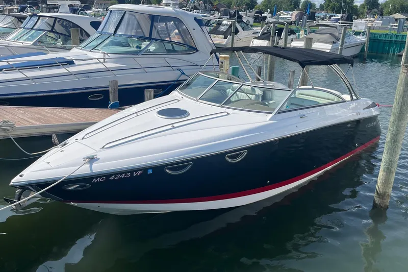 The Image of 2008 Cobalt 323 boat docked at marina, featuring sleek design and spacious interior. - 0