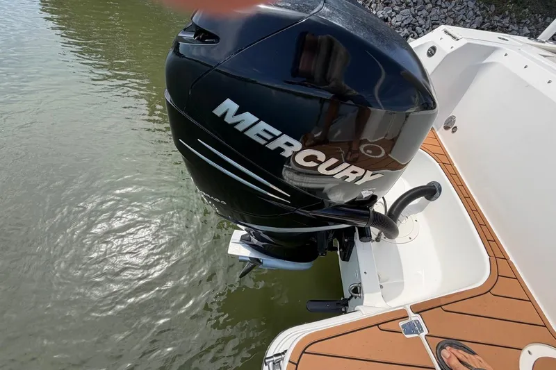 Slide: The Image of Boston Whaler 240 Vantage 2022 with Mercury outboard motor on water. - 26