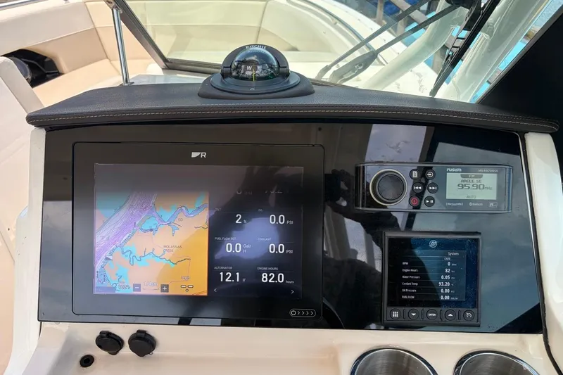 Slide: The Image of Dashboard of a 2022 Boston Whaler 240 Vantage with navigation and control systems. - 14