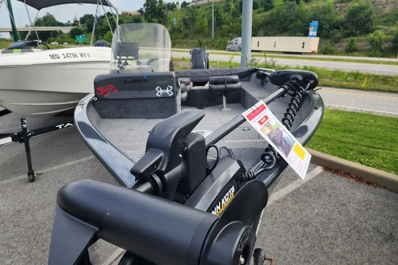 Slide: The Image of 2020 Tracker Pro Guide V-16 SC boat with Garmin equipment, parked outdoors. - 7