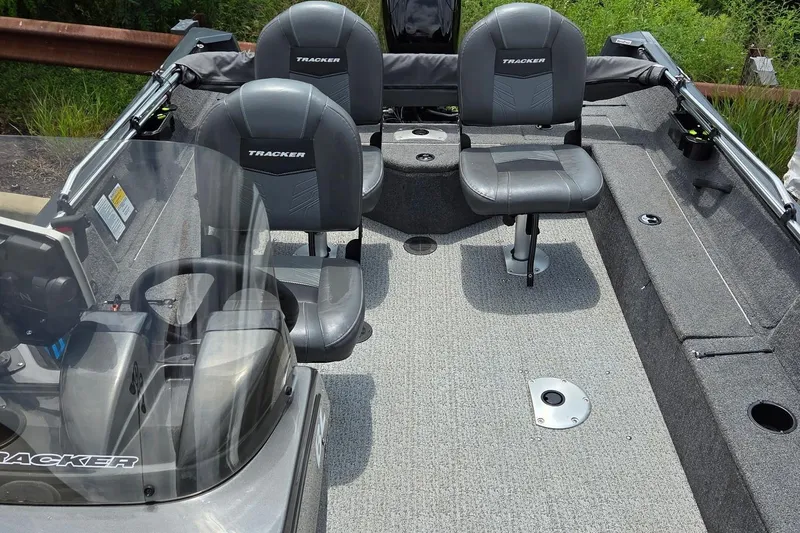 Slide: The Image of 2020 Tracker Pro Guide V-16 SC boat interior with seating and steering console. - 3