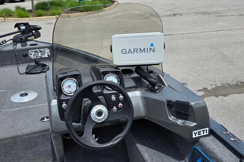 Slide: The Image of 2020 Tracker Pro Guide V-16 SC boat dashboard with Garmin GPS and Yeti sticker. - 2