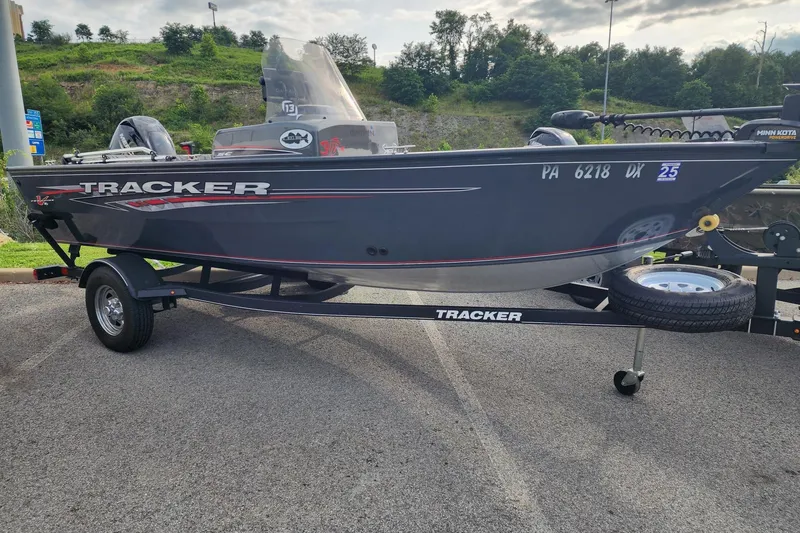 Slide: The Image of 2020 Tracker Pro Guide V-16 SC boat on trailer, parked outdoors. - 9