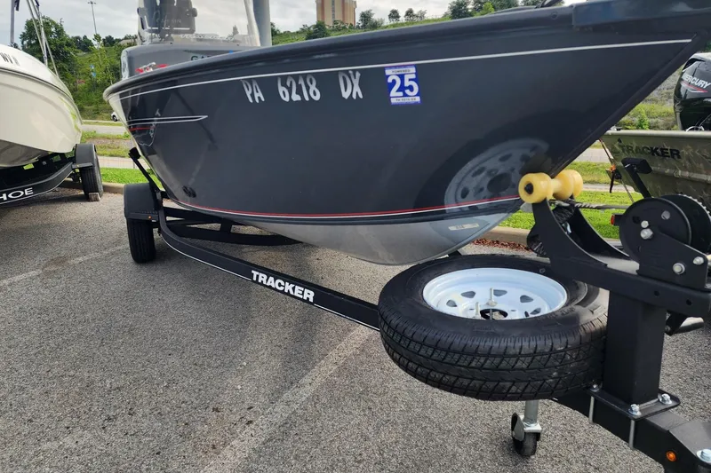 Slide: The Image of 2020 Tracker Pro Guide V-16 SC boat on trailer, parked outdoors. - 5