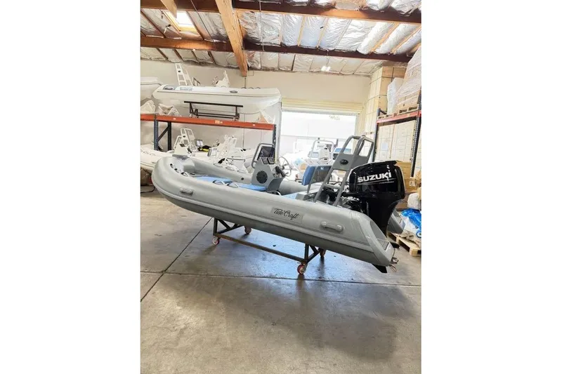 The Image of 2026 Tide Craft Custom Grey and Blue Catalina 13 boat in a warehouse setting. - 1
