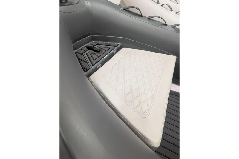 The Image of 2027 Tide Craft Nantucket 12 boat interior with custom grey seating and diamond pattern design. - 11