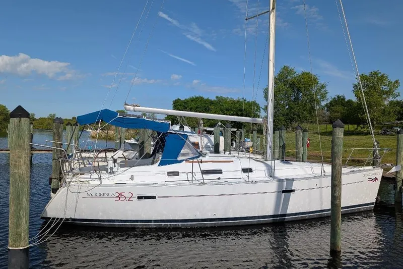 Slide: The Image of Sailboat docked at marina, Beneteau 343, 2006 model, clear sky background. - 1