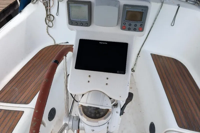 Slide: The Image of Cockpit of 2006 Beneteau Oceanis 352 sailboat with navigation instruments. - 3