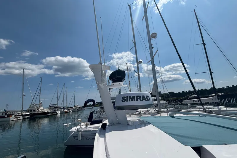 Slide: The Image of Docked boats under a clear sky, featuring a 2025 Axopar 29 XC Cross Cabin. - 36