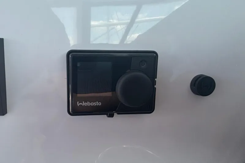 Slide: The Image of Webasto control panel on 2025 Axopar 29 XC Cross Cabin boat interior. - 33
