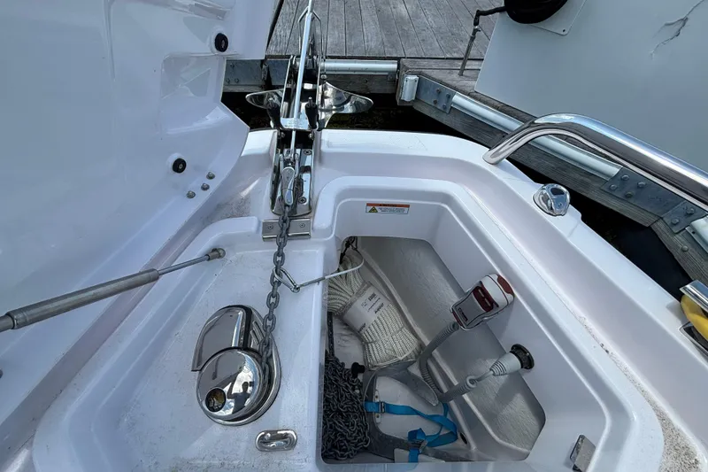 Slide: The Image of Anchor compartment of 2025 Axopar 29 XC Cross Cabin with chain and equipment. - 31