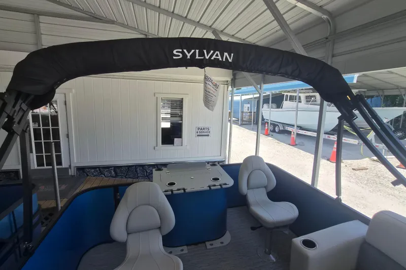 Slide: The Image of 2026 Sylvan Mirage Fish 820 Party Fish boat interior with seating and canopy. - 18