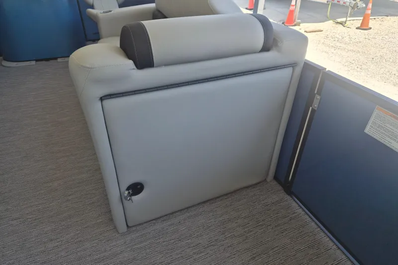 Slide: The Image of 2026 Sylvan Mirage Fish 820 Party Fish boat interior with cushioned seating and storage compartment. - 6