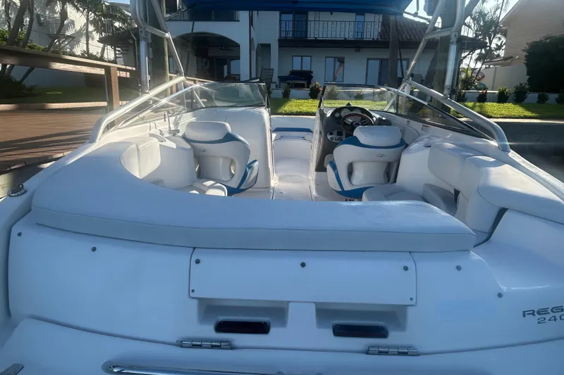 Slide: The Image of 2009 Regal 2400 Bowrider boat with spacious seating and sleek design. - 15