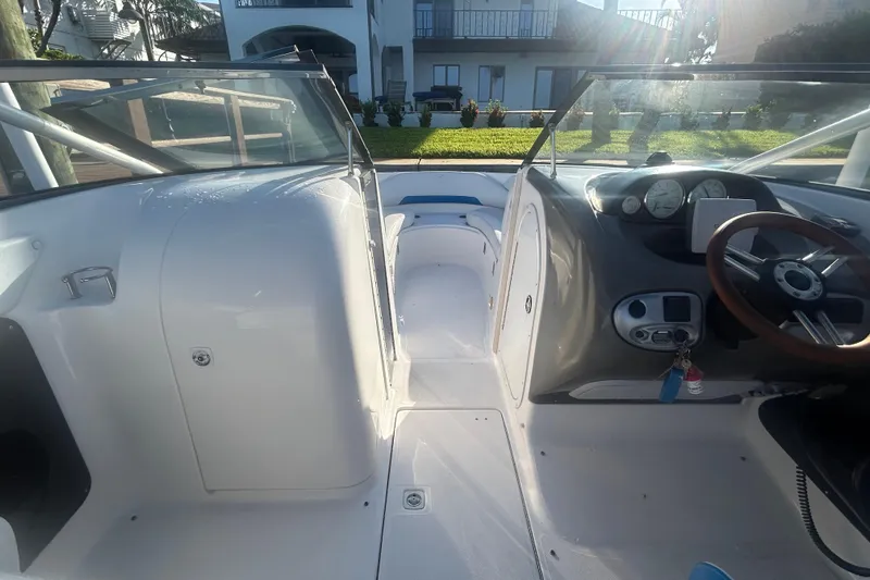 Slide: The Image of 2009 Regal 2400 Bowrider interior with steering wheel and dashboard, showcasing sleek design. - 35