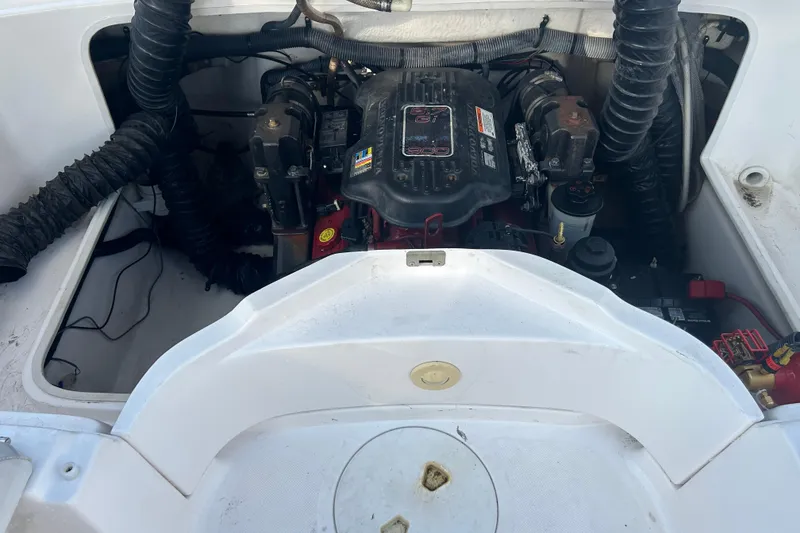 Slide: The Image of Engine compartment of a 2009 Regal 2400 Bowrider boat, showing detailed components. - 65