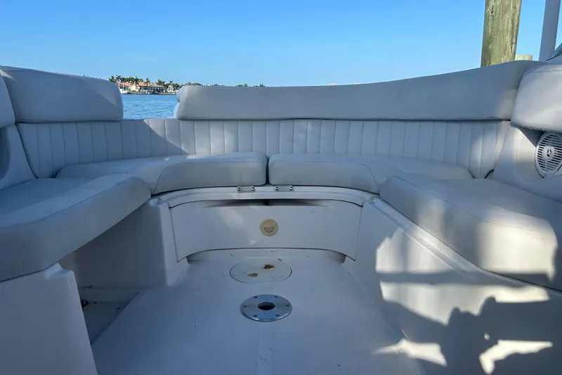 Slide: The Image of 2009 Regal 2400 Bowrider interior with spacious seating and waterfront view. - 61