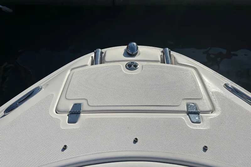 Slide: The Image of The bow of a 2009 Regal 2400 Bowrider with anchor locker and stainless steel fittings. - 40
