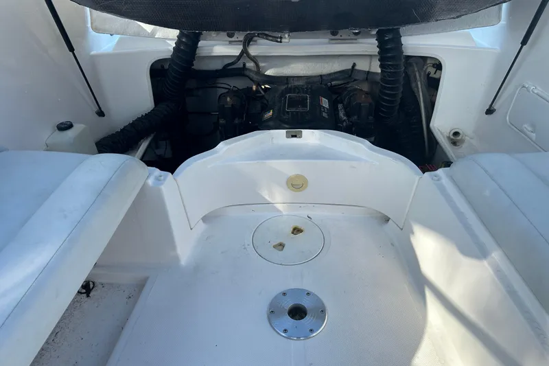 Slide: The Image of 2009 Regal 2400 Bowrider engine compartment with seating area, showcasing interior details. - 64