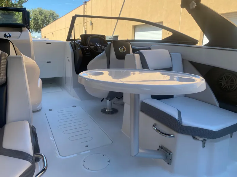 Slide: The Image of 2025 Scarab 255 ID boat interior with seating and table. - 17