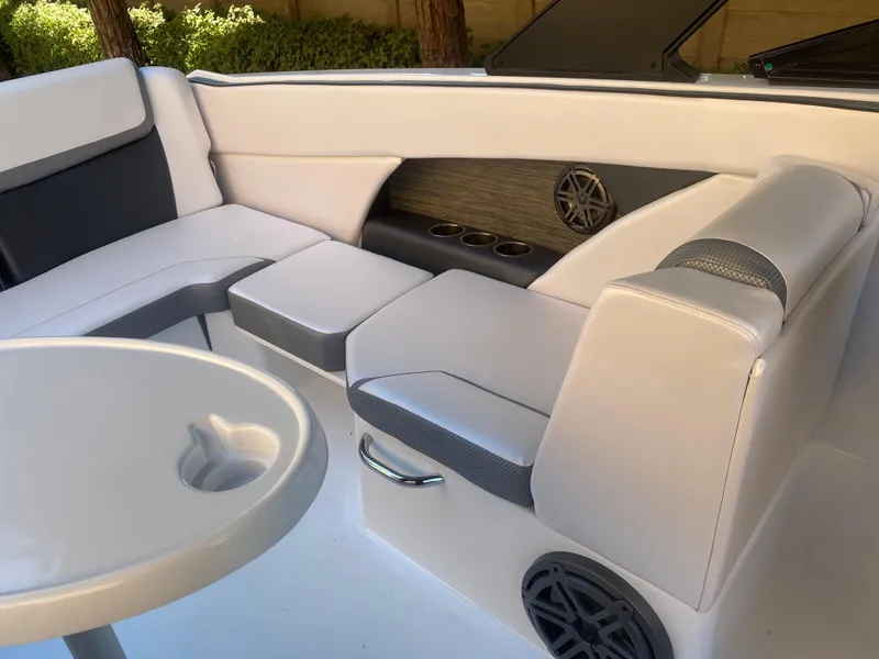 Slide: The Image of Interior of 2025 Scarab 255 ID boat with white seating and cup holders. - 22