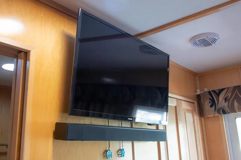 Slide: The Image of Flat-screen TV and soundbar in 2001 Stardust Cruisers Executive Aft Cabin interior. - 46