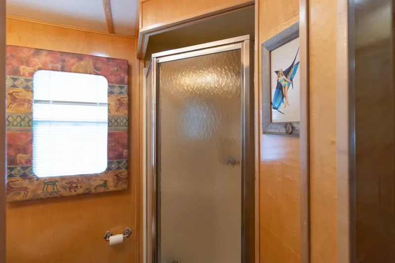 Slide: The Image of Bathroom interior of 2001 Stardust Cruisers Executive Aft Cabin with shower and decorative elements. - 30