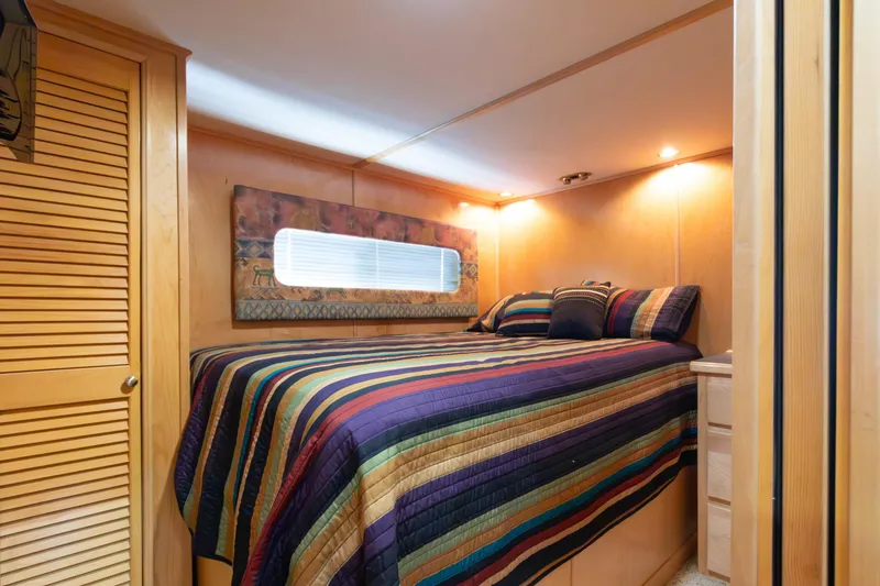 Slide: The Image of Cozy bedroom in 2001 Stardust Cruisers Executive Aft Cabin with colorful bedding. - 26