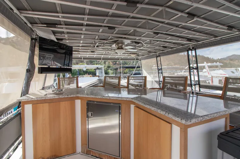Slide: The Image of 2001 Stardust Cruisers Executive Aft Cabin with spacious outdoor seating and modern amenities. - 61