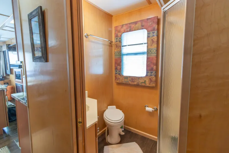 Slide: The Image of Bathroom interior of 2001 Stardust Cruisers Executive Aft Cabin with shower and toilet. - 29