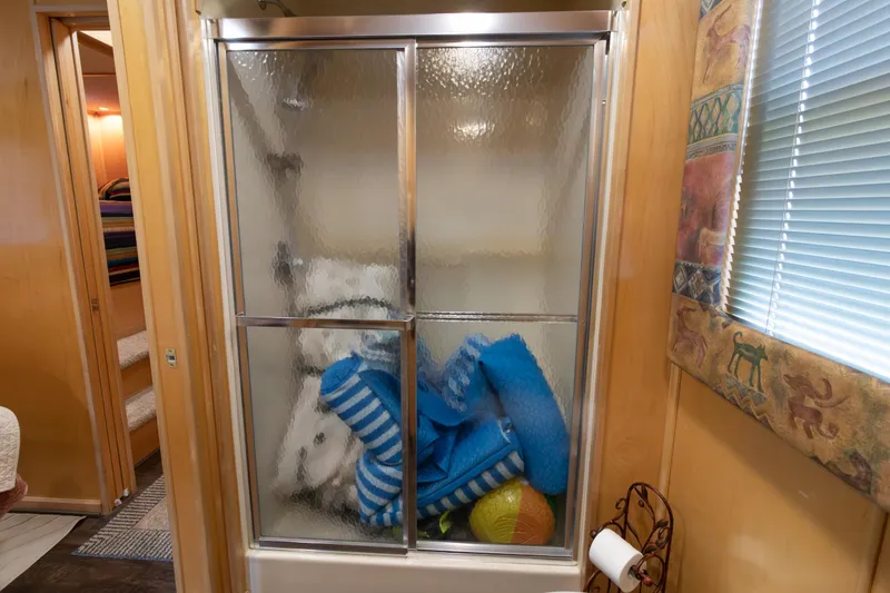 Slide: The Image of Shower stall in 2001 Stardust Cruisers Executive Aft Cabin with pool floats inside. - 40