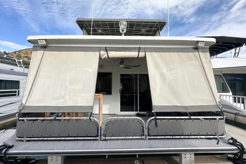 Slide: The Image of 2001 Stardust Cruisers Executive Aft Cabin houseboat with covered deck and sliding doors. - 3