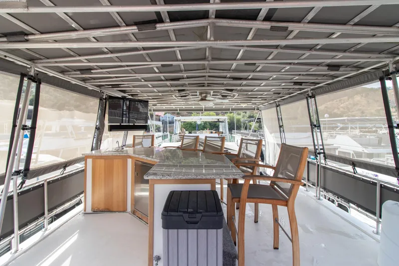 Slide: The Image of Spacious 2001 Stardust Cruisers Executive Aft Cabin with outdoor seating and bar area. - 59