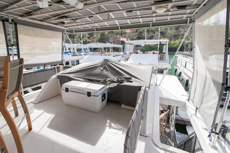 Slide: The Image of 2001 Stardust Cruisers Executive Aft Cabin with covered deck and seating area. - 63
