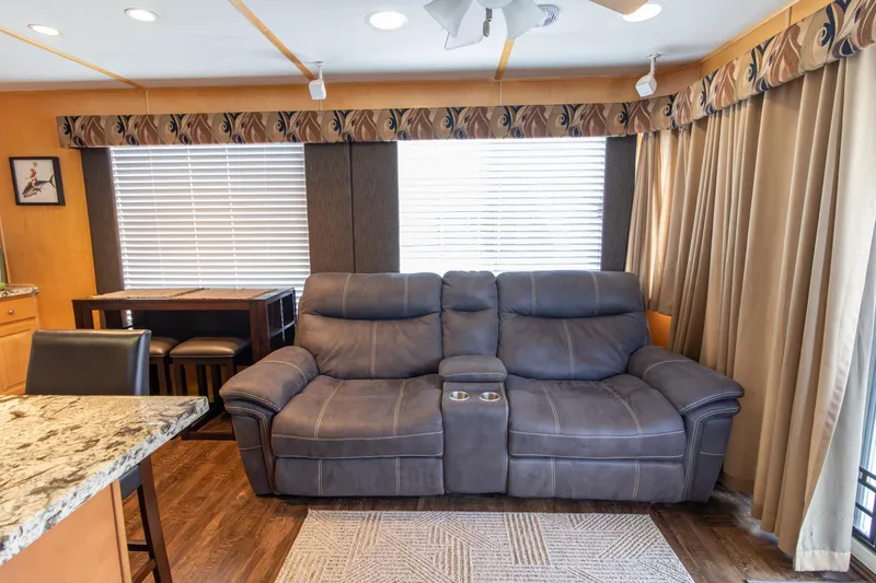 Slide: The Image of Luxurious interior of 2001 Stardust Cruisers Executive Aft Cabin with plush seating and elegant decor. - 10