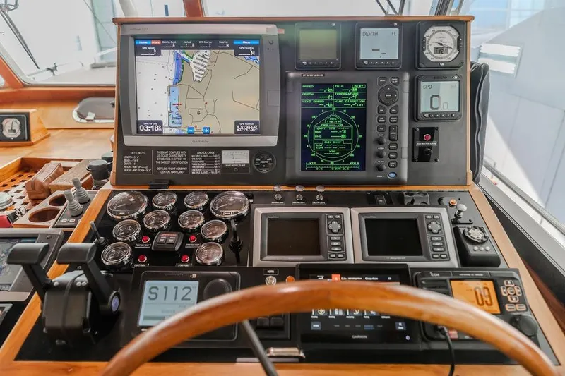Slide: The Image of Control panel of a 2012 Dettling Motoryacht with navigation and monitoring instruments. - 2