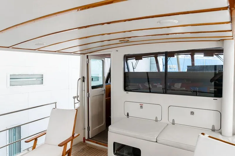 Slide: The Image of Interior view of 2012 Dettling Motoryacht with seating and wooden accents. - 18