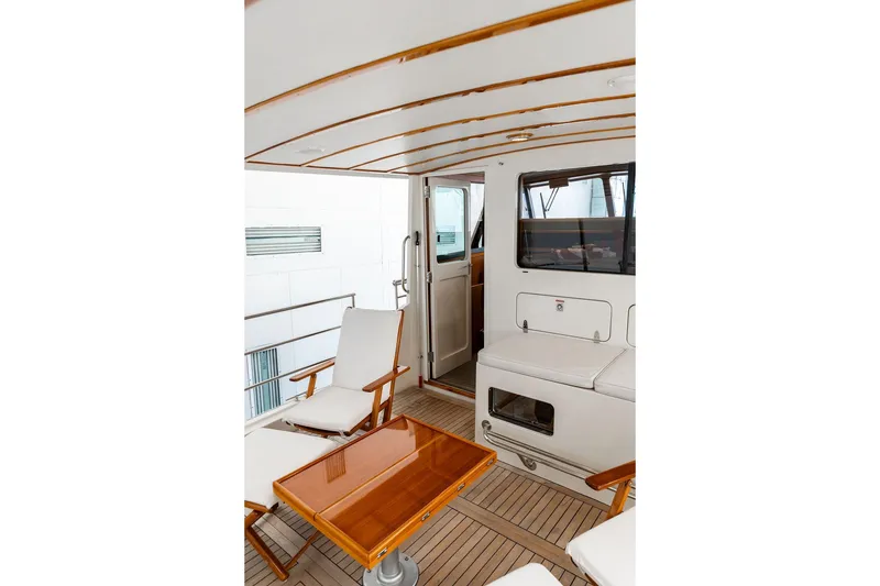 Slide: The Image of Luxurious 2012 Dettling Motoryacht interior with elegant seating and wooden table. - 19