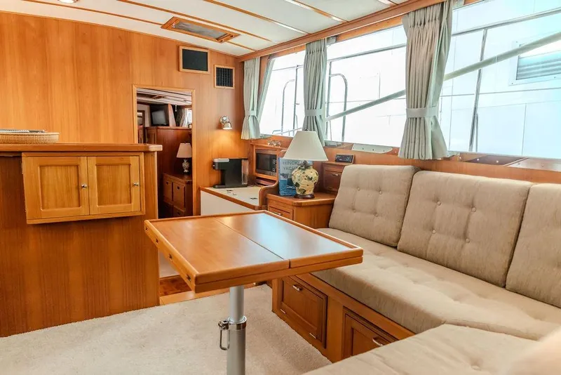 Slide: The Image of Luxurious interior of 2012 Dettling Motoryacht with wood paneling and plush seating. - 25