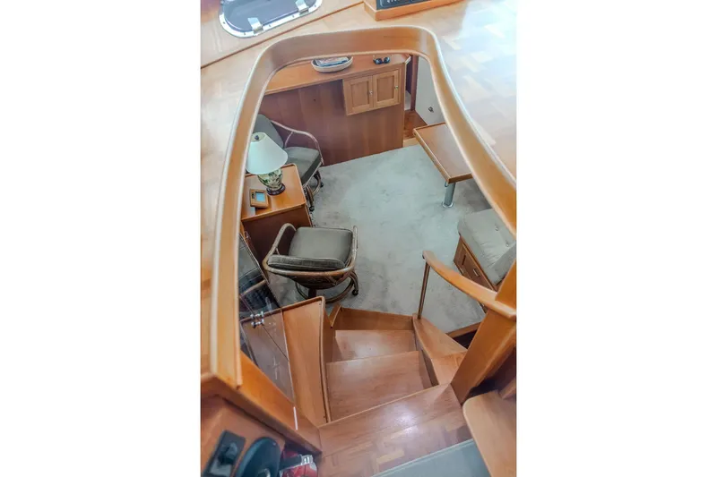 Slide: The Image of Interior view of 2012 Dettling Motoryacht with wooden stairs and cozy seating area. - 22