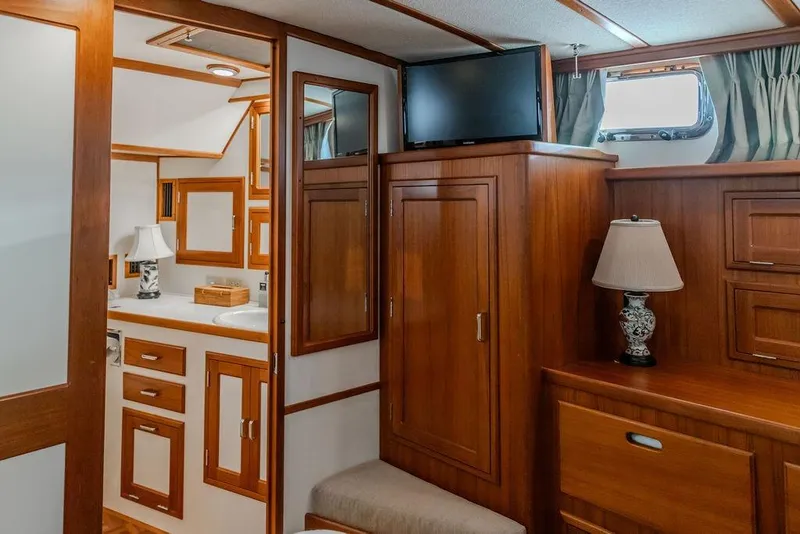 Slide: The Image of Luxurious 2012 Dettling Motoryacht interior with elegant wood cabinetry and modern amenities. - 34