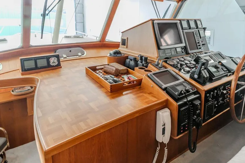 Slide: The Image of Control panel of a 2012 Dettling Motoryacht with navigation instruments and wooden finish. - 14